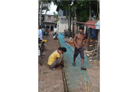 Fishermen from the community preparing bait nets for deep sea fishing in Namkhana, West Bengal
